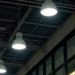 Facility manager reviewing energy savings from an LED lighting retrofit in a UAE commercial building