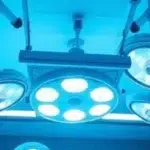 Modern hospital operating room equipped with advanced LED surgical lighting for precision, shadow control, and patient safety